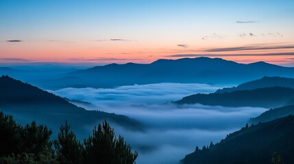 Fototapeta premium Misty mountain range at sunrise