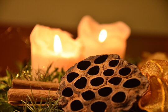 burning candle on a wooden background