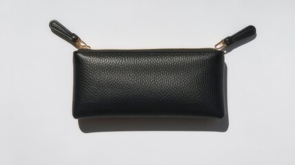 Naklejka premium Elegant black leather coin purse with dual zipper pulls studio aesthetic