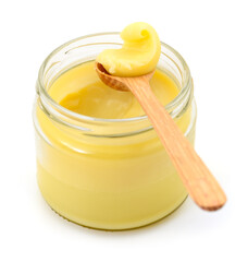 Ghee in a glass jar isolated.