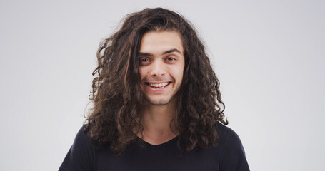 Portrait, man and smile with messy hair in studio for natural growth, frizz problem and dry...