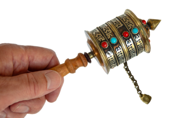 Buddhist Scripture Wheel, hand held spinning Prayer Wheel. The cylinder turn around a handle with a slight rotation of the wrist. Image isolated on white transparent background.