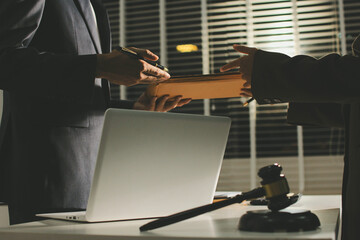 Lawyer explained to the client about the law that must be brought against the court case.