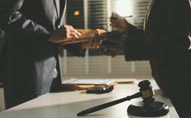 Lawyer explained to the client about the law that must be brought against the court case.