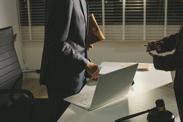 Lawyer explained to the client about the law that must be brought against the court case.