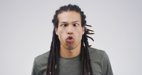 Goofy man, funny face or expression with attitude for joke or comic on a white studio background....