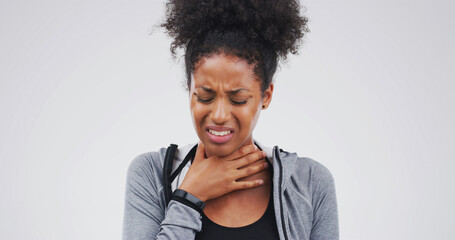 Upset, sick or black woman with itchy throat on studio space for cold, sore voice or virus...