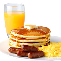 Golden Brown Pancakes Stacked High with Melted Butter and Drizzled Syrup Served with Scrambled Eggs and Sausages Accompanied by a Glass of Orange Juice on a White Plate
