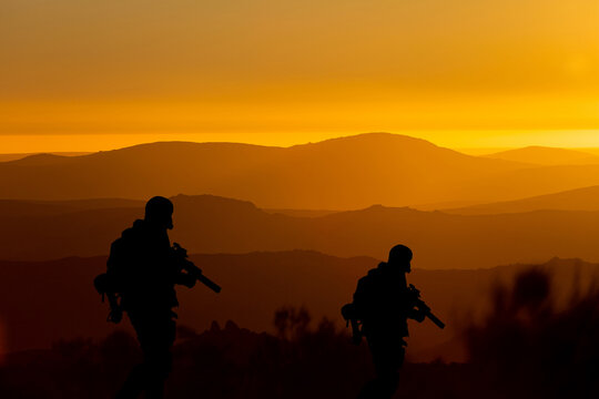 Conceptual image of war with sunset and soldier silhouette