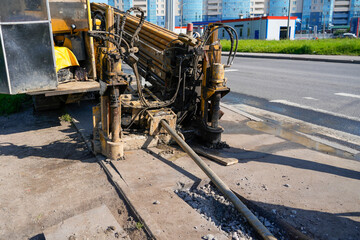 Fototapeta premium Directional pipe laying method during operation, horizontal drilling, laying of communications under the road and asphalt without excavation and soil ore mining