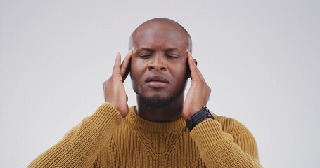 Stress, migraine and black man in studio with pain, brain fog and fibromyalgia on white background....