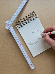 Hand Drawing DIY Project Plan with Measuring Tool