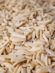 White Almond Stick set on wooden board and white background.