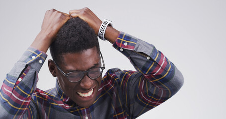 Black man, frustrated and burnout with stress, crisis and isolated on white background with...