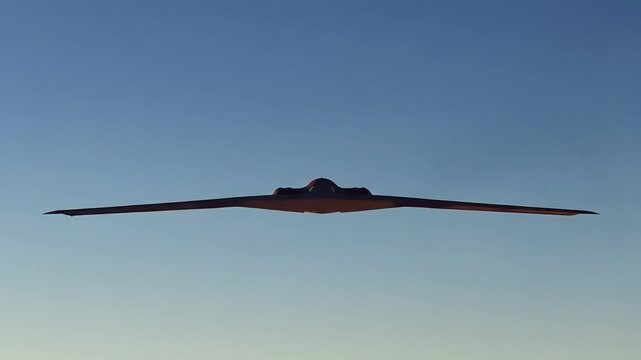 Stealth Bomber Ascends: B-2 Spirit Soaring Through Shifting Skies at Sunset