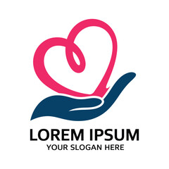 Heart symbol held in hand representing care charity support and wellbeing concepts