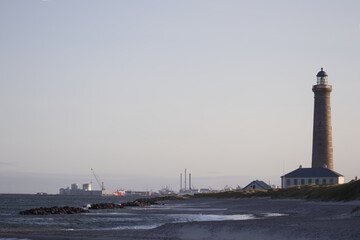 Coastal Landscape with Lighthouse, Sandy Shore, and Port Background