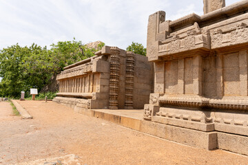A stone building with a stone wall and a stone pillar