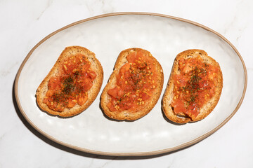 Top view of tomato toast traditional Spanish food on kitchen countertop