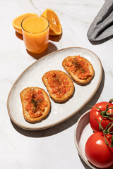 Pan con tomate, tomato toast traditional Spanish food on kitchen countertop
