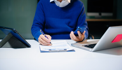 man Account Manager Working at Table with New Business Project. Typing keyboard,Using Contemporary...