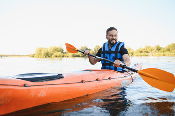 Kayaker paddling on river enjoying water sports and recreation