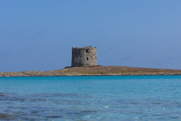 Caletta della Torre beautiful view of ruined tower on la pelosa beach sardinia italy