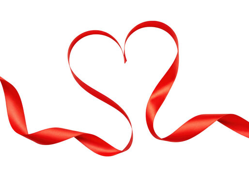 A shiny red ribbon elegantly forms a heart shape, isolated on a transparent background
