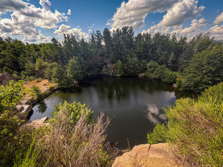 Peaceful Quarry Pond Framed by Verdant Trees