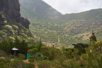 Shaded shelter and hillside trail in Teno