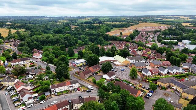 Aerial establishing shot of the Maidstone Masonic Centre in Kent, town with homes, schools and green trees