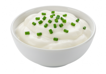 A white bowl filled with creamy sour cream or yogurt, garnished with chopped chives, isolated on white isolated on transparent background