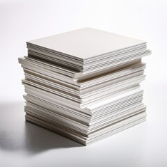 Stack of clean, white sheets of paper arranged neatly on a flat surface in a well-lit environment