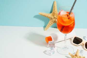 Aperol Spritz, Summer alcohol cocktail drink at blue background.