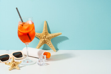 Aperol Spritz, Summer alcohol cocktail drink at blue background.