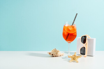 Aperol Spritz, Summer alcohol cocktail drink at blue background.