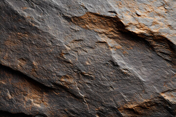 Natural stone texture background with dark hues and rugged surfaces, showcasing unique patterns and earthy tones that evoke sense of nature