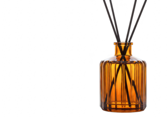 An amber glass reed diffuser bottle with black sticks, emitting fragrance, isolated on a transparent background