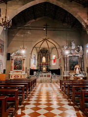 Inside a historic church showcasing intricate architecture and serene ambiance in the afternoon