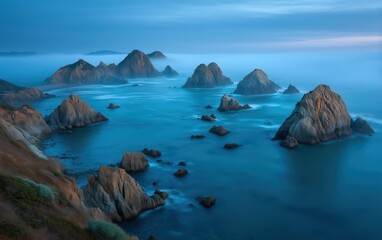 Ethereal Coastal Landscape Captivating Rocky Seascape with Serene Ocean and Misty Atmosphere. Fine Art of the Pacific Coast, a Moody Blue Composition.