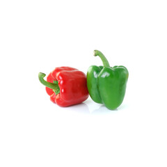 Red and green bell peppers side by side on white background, ideal for food blogs, cooking...