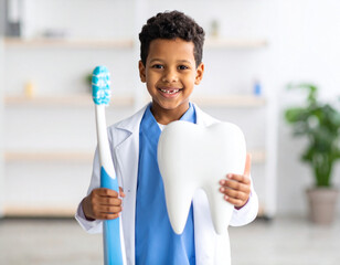 Child participates in dental education activity holding oversized toothbrush and model tooth in bright clinic environment