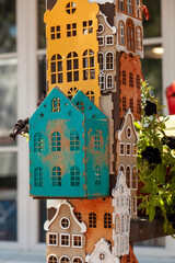 Decorative plywood houses are displayed in a charming exhibition