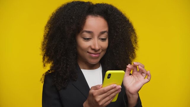 Surprised woman emotionally scrolling on smartphone