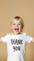 Thank you is written on a white T-shirt worn by a cheerful child. Thank You Day.