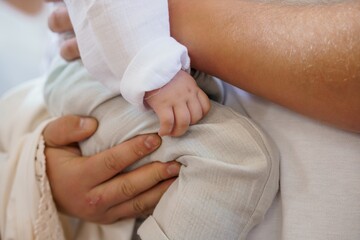 Tender Moment: Father Holding Newborn Baby's Hand, Close-Up, Soft Pastel Colors, Family Love, First Touch, Gentle Parenting, Portrait.