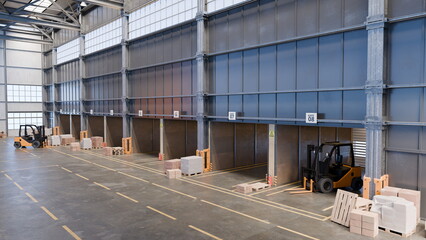 Workers are organizing goods in a spacious warehouse featuring multiple loading docks. 3d render