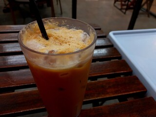A refreshing thai tea drink with a sweet blend of milk and tea.