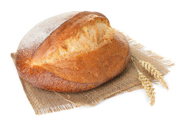 Loaf of fresh bread and spikes isolated on white
