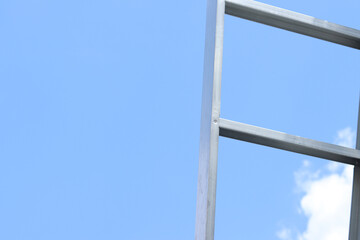 Lightweight steel thin-walled structures. Frames for warehouses, garages or houses. Structure of a steel frame for construction against the sky